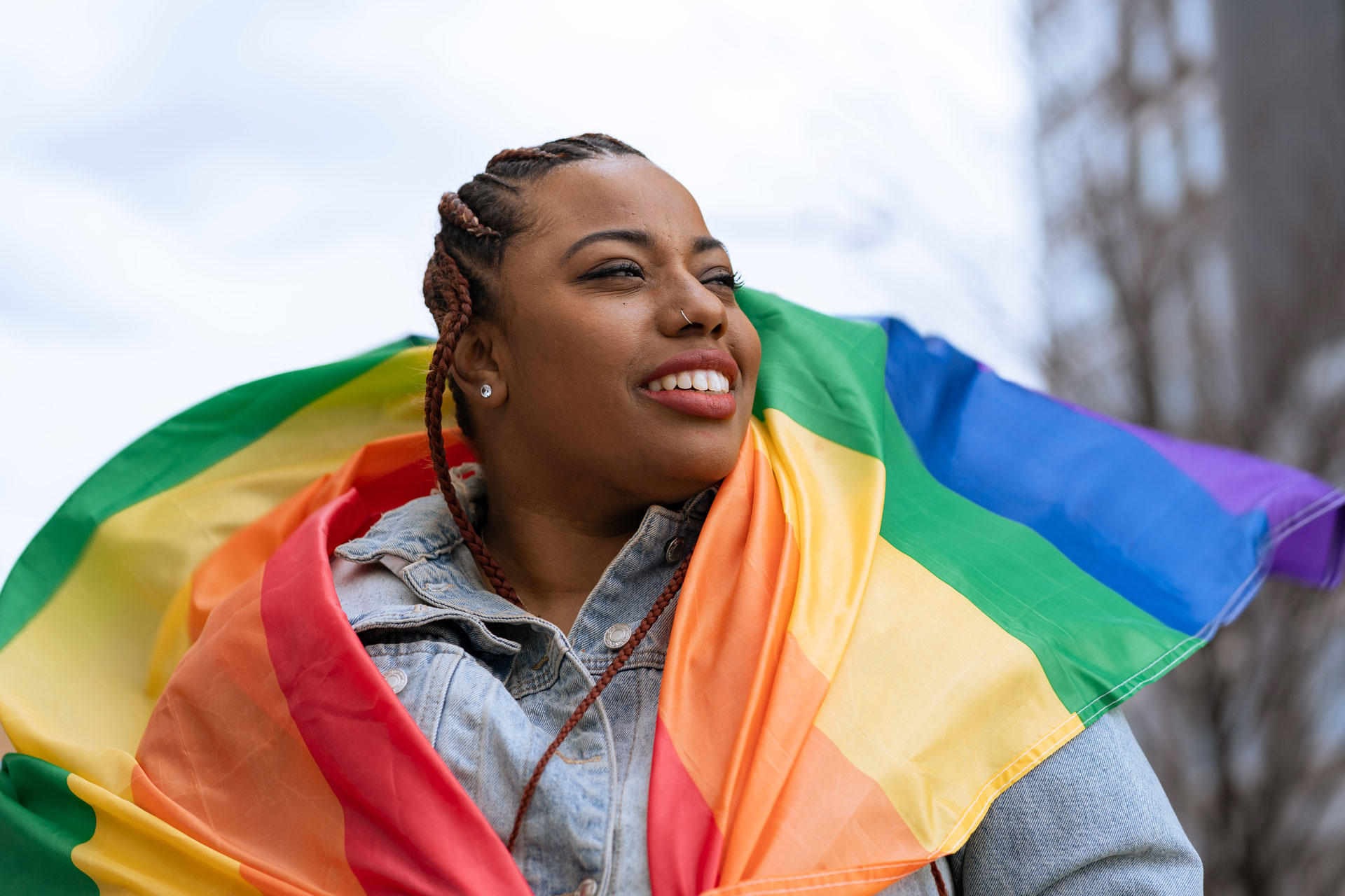 woman with Pride flag on shoulders