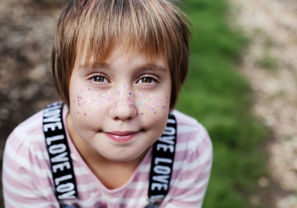 child with stars on face