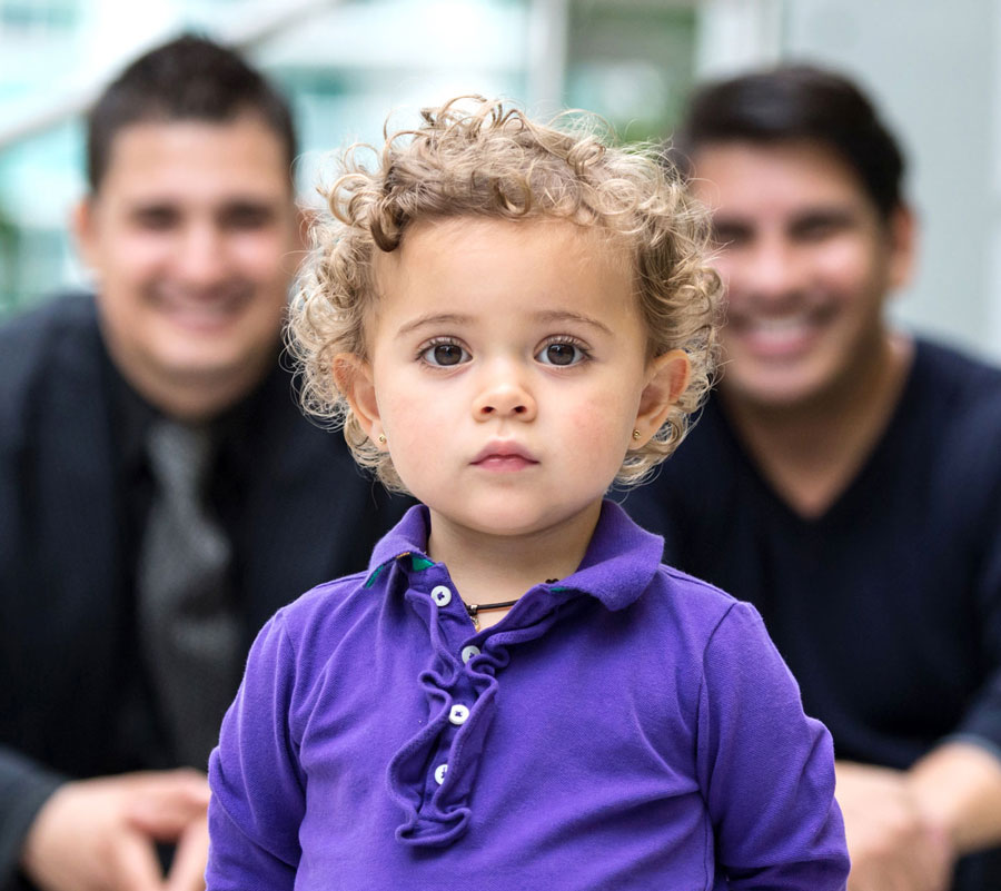 happy parents with child in foreground in focus