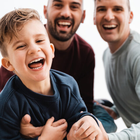 laughing parents with toddler