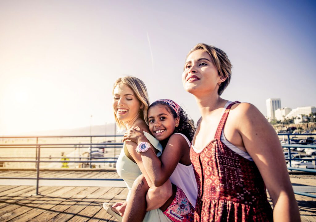 parents and child on boardwalk