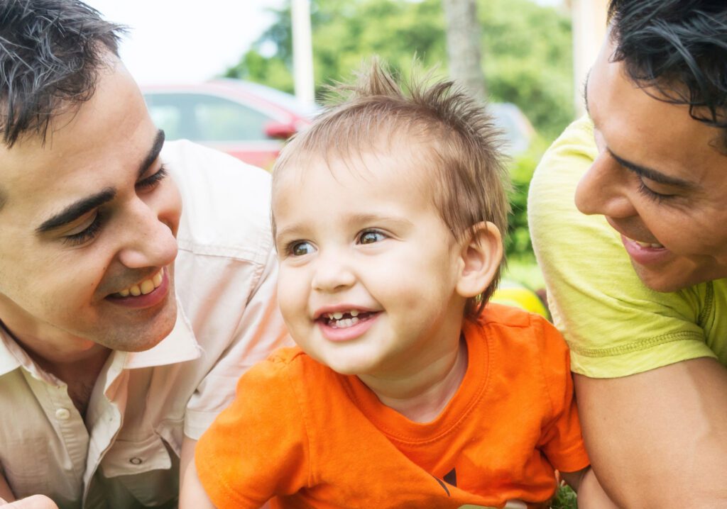 smiling parents and infant