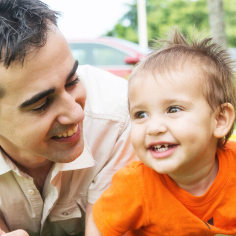 smiling parents and infant