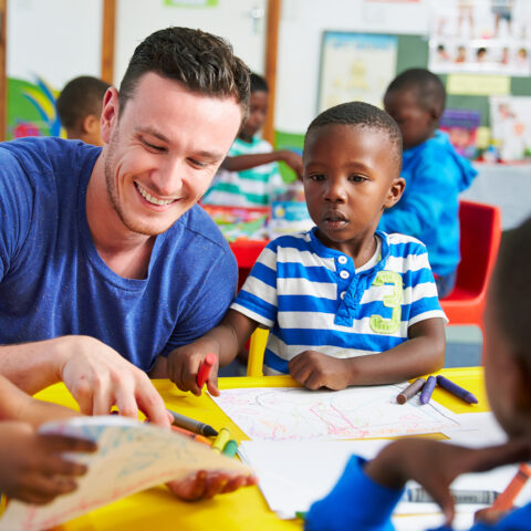 teacher and children drawing