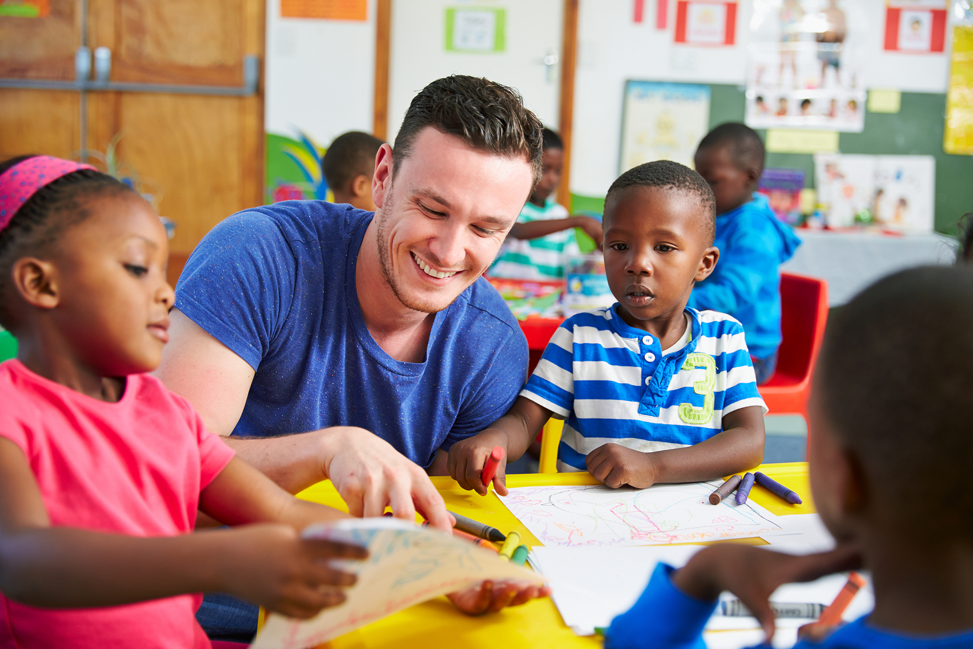 teacher and children drawing